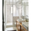 White porcelain wall light with glass globe for bathroom or outdoor use.
