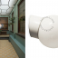 White porcelain wall light with glass globe for bathroom or outdoor use.