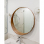 White porcelain wall light with glass globe for bathroom or outdoor use.