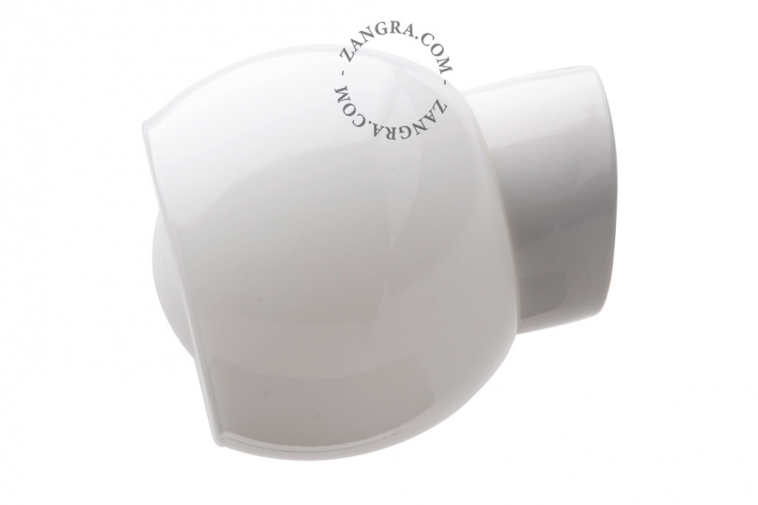 White porcelain wall light with glass globe for bathroom or outdoor use.