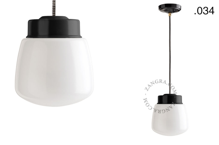 Black porcelain pendant light with glass shade.