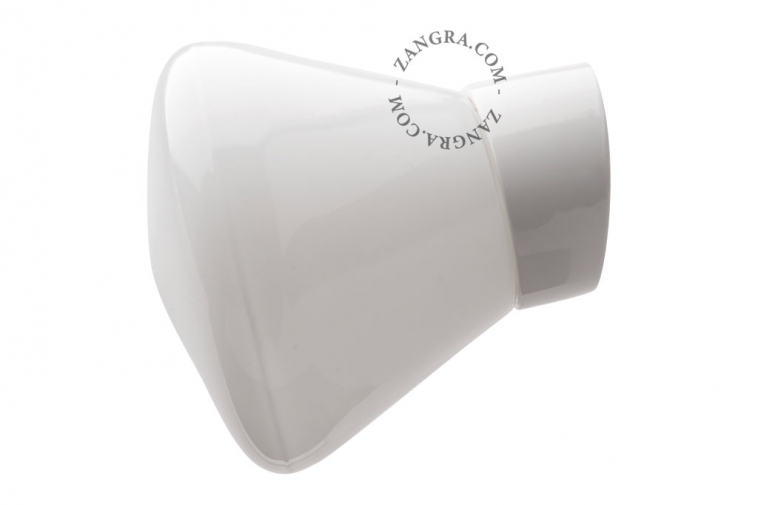 White porcelain wall light with glass globe for bathroom or outdoor use.