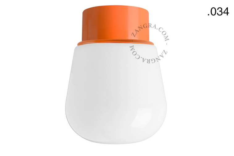 Orange ceiling light with glass shade.