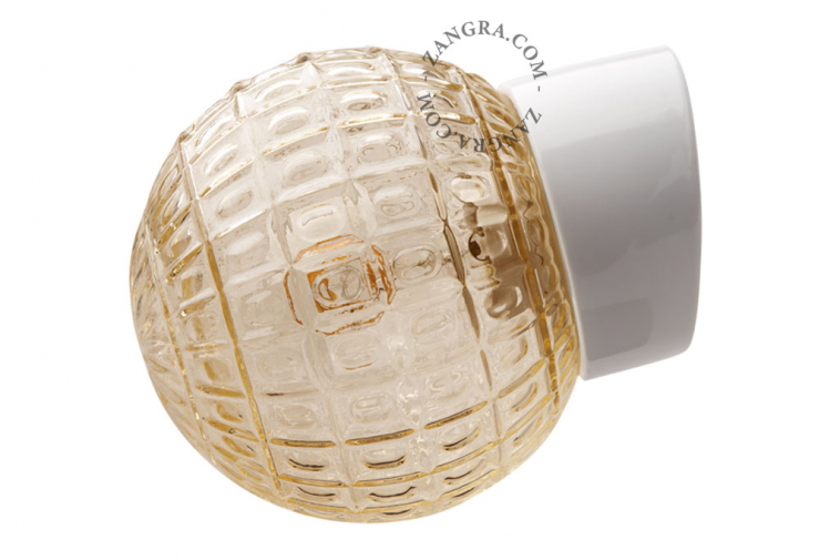 White porcelain wall light with glass globe for bathroom or outdoor use.