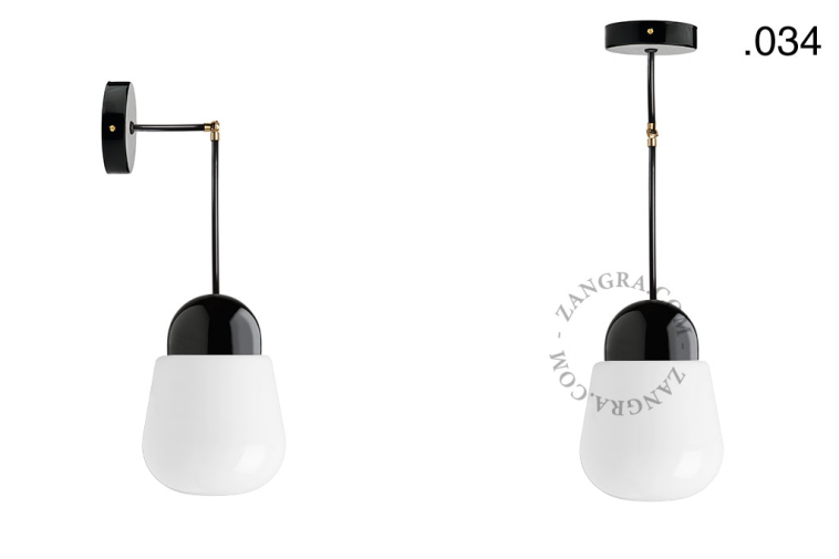 Black porcelain wall or ceiling light with glass shade.