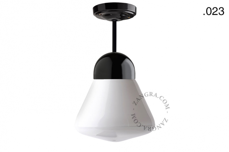 Black porcelain ceiling light with glass shade.