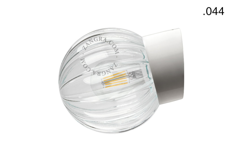 White porcelain wall light with glass globe for bathroom or outdoor use.