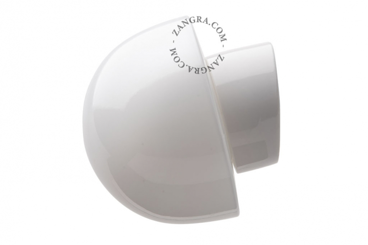 White porcelain wall light with glass globe for bathroom or outdoor use.