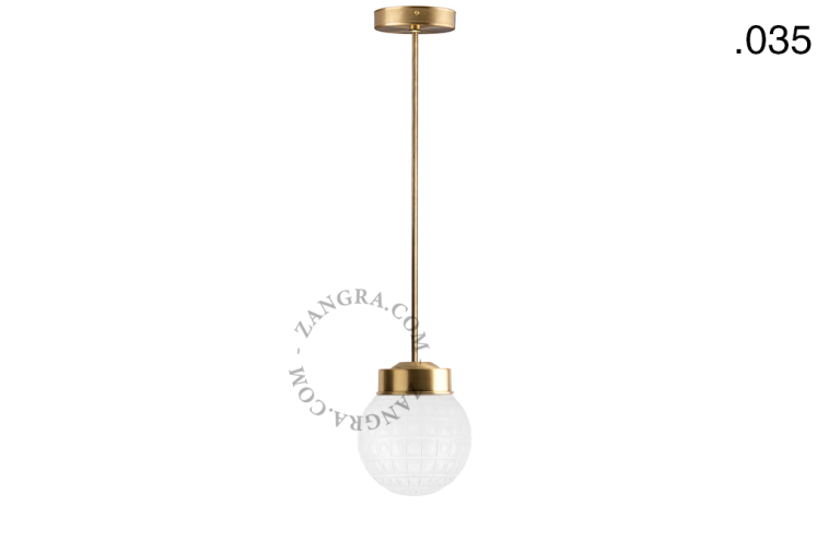Retro brass pendant light with glass shade.