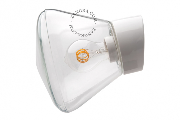 White porcelain wall light with glass globe for bathroom or outdoor use.