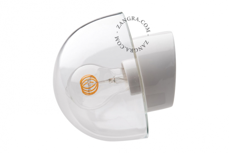 White porcelain wall light with glass globe for bathroom or outdoor use.
