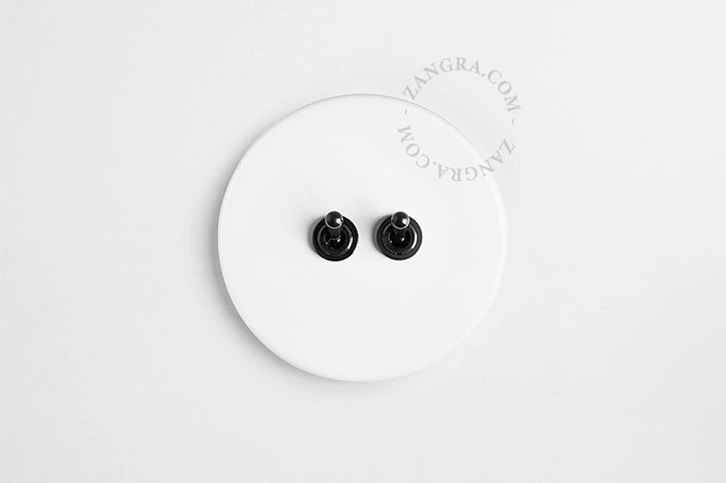 double interrupteur en porcelaine blanche va-et-vient ou simple - leviers noirs