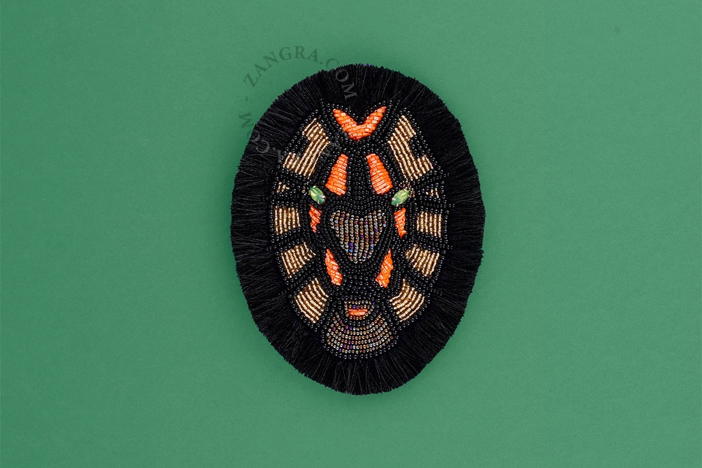 broche cabeza de león