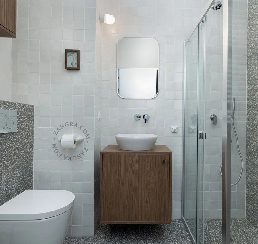 white porcelain toilet paper holder