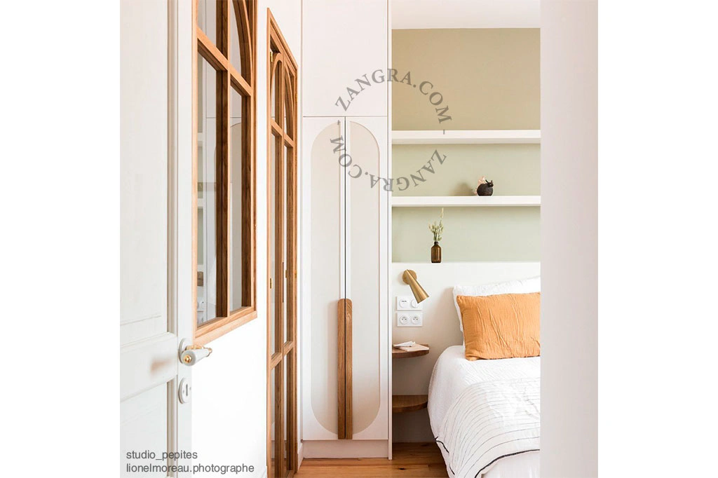 white porcelain and brass double door handle