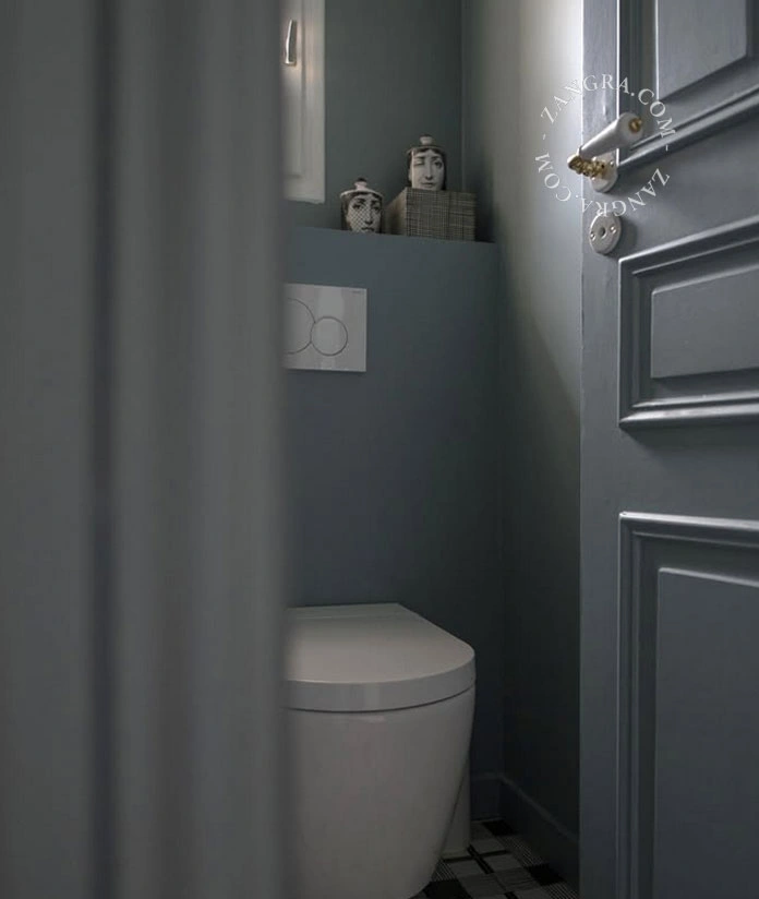 white porcelain and brass double door handle