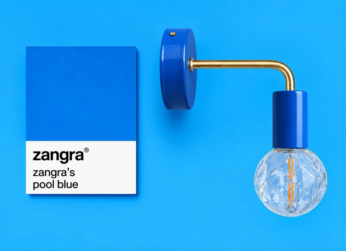 blue wall light with brass arm