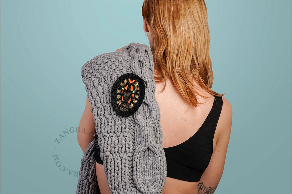 broche cabeza de león
