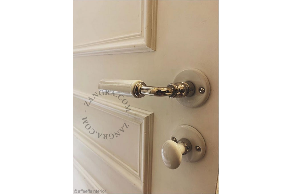 white porcelain rosette and thumb turn lock