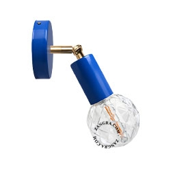 blue adjustable wall light with brass arm
