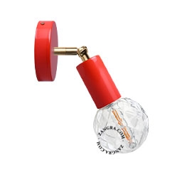 red adjustable wall light with brass arm