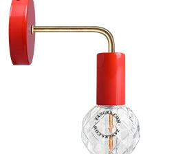 red wall light with brass arm