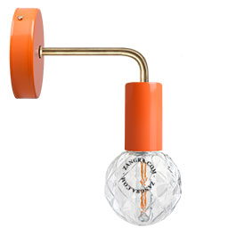 orange wall light with brass arm