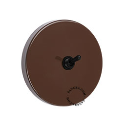 Round brown light switch.