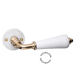 White porcelain and brass door handle.