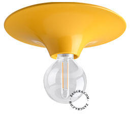 Round yellow wall or ceiling light.