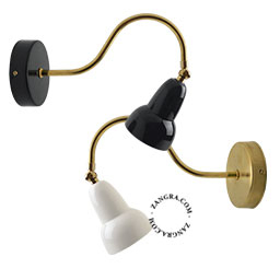 Ceramic swan neck adjustable light with brass arm.
