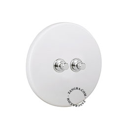 Matte white porcelain switch with double nickel-plated pushbuttons.