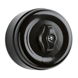 Surface mount black bakelite rotary switch.