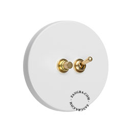 double interrupteur blanc rond avec bouton-poussoir et levier en laiton brut