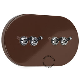 Large brown light switch with 4 levers.