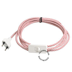 White and red dots textile cable with plug and switch.