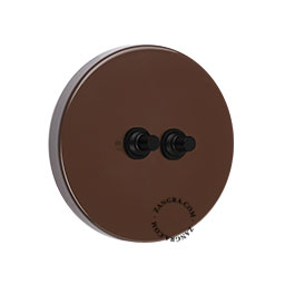 Round brown double pushbutton switch.