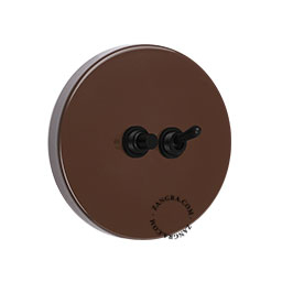 Round brown light switch.