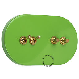 Grand interrupteur vert avec 2 boutons-poussoirs et 2 leviers en laiton brut.