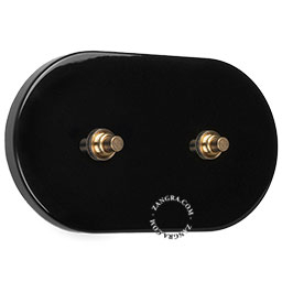 double interrupteur-poussoir noir avec deux boutons-poussoirs en laiton brut