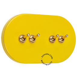 interrupteur jaune et encastrable avec 4 leviers en laiton
