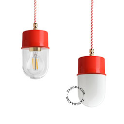 Red pendant light with glass shade.