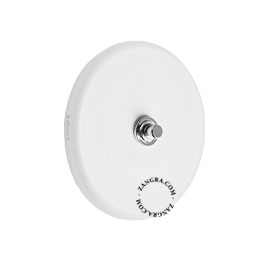 Round white porcelain light switch.