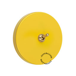 interrupteur jaune rond et encastrable avec levier en laiton