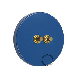 interrupteur avec deux boutons-poussoirs en laiton brut - le boitier est en acier laque bleu