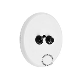 Round white porcelain light switch.