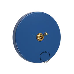 Blue round switch with brass lever.