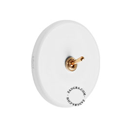 Round white porcelain light switch.