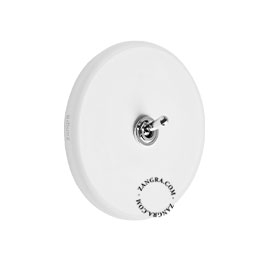 Round white porcelain light switch.