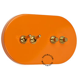 grand interrupteur orange avec 2 boutons-poussoirs et 2 leviers en laiton brut